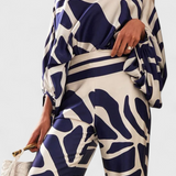 Ensemble de Deux Pièces Sybella avec Top Off-the-Shoulder et Pantalons Amples Imprimés