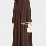 Abaya fluide de Genève avec broderie dorée